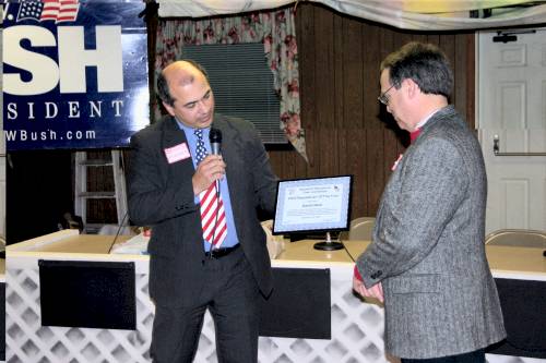 Dennis Fonseca presents Dave Neal with 2005 Republican of the Year Award at the President's Day Event